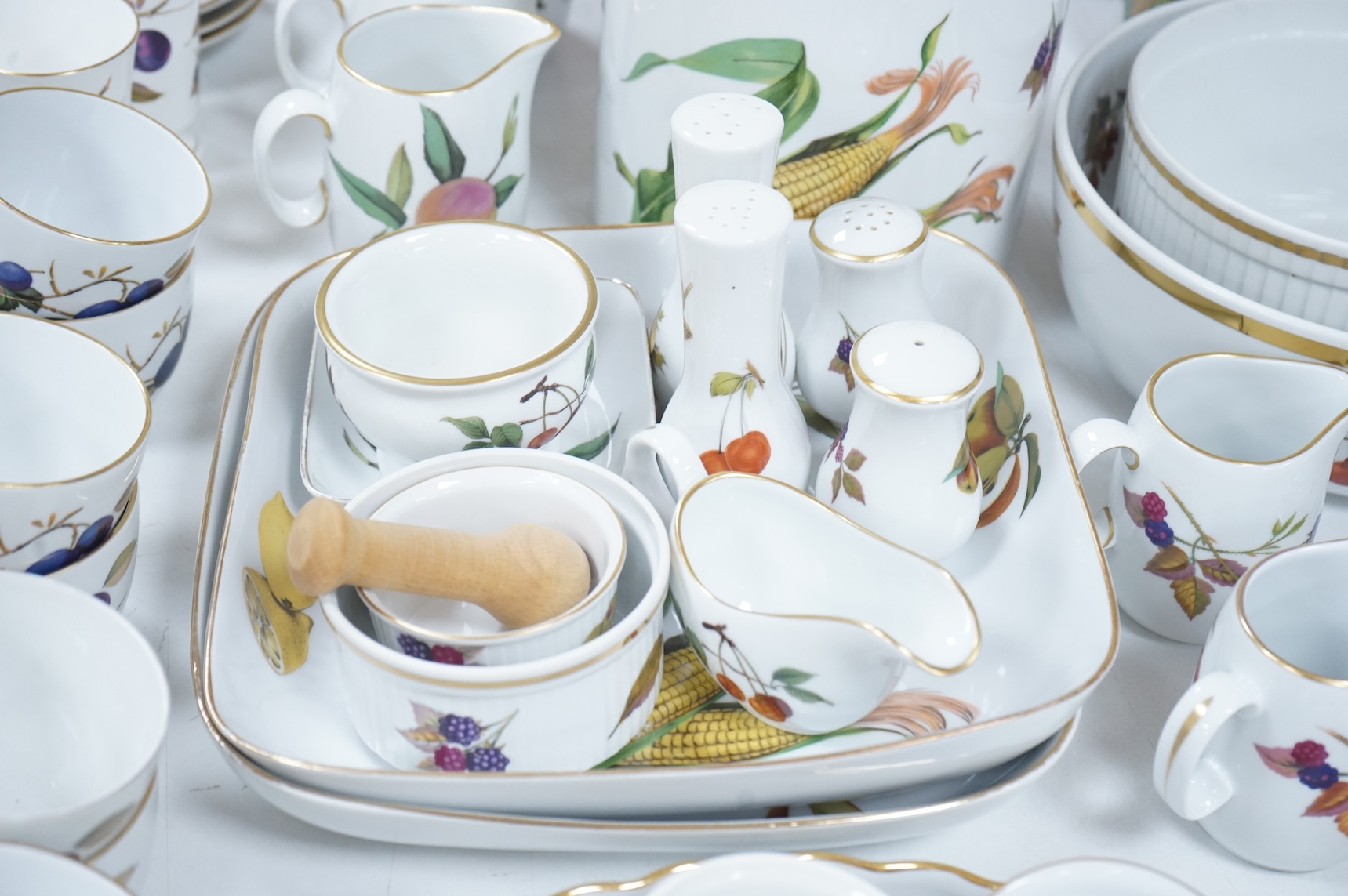 A collection of Royal Worcester Evesham tea and kitchen wares, including storage jars, casserole dishes and cover, flan dishes, serving dishes, tea cups and saucers etc.